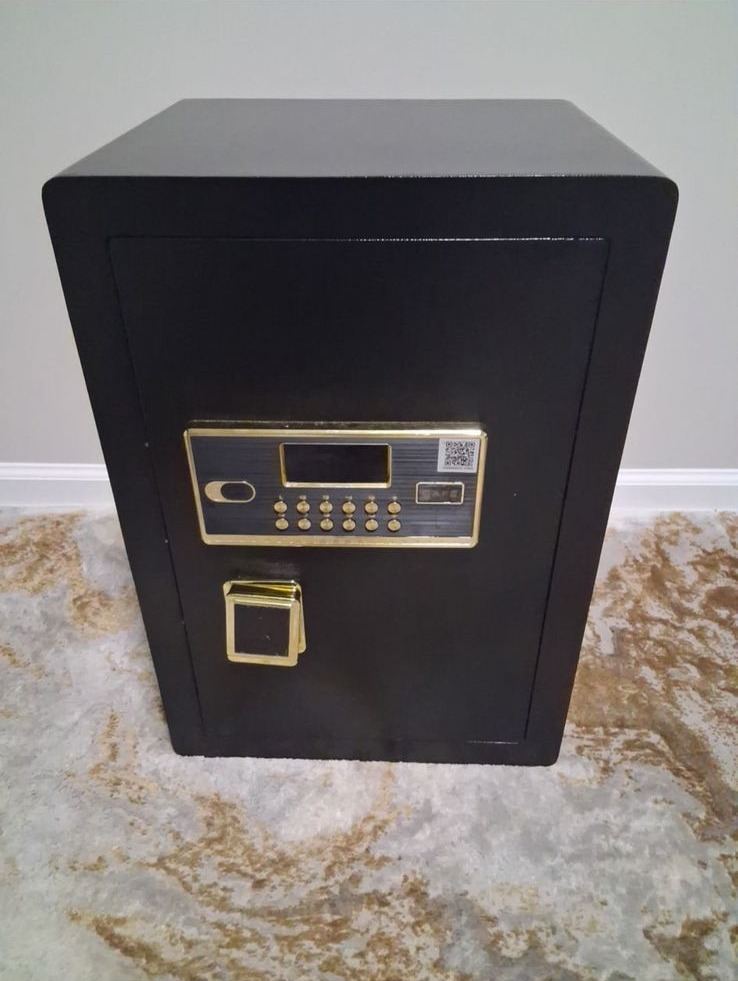 Black safe with gold-colored digital keypad and handle