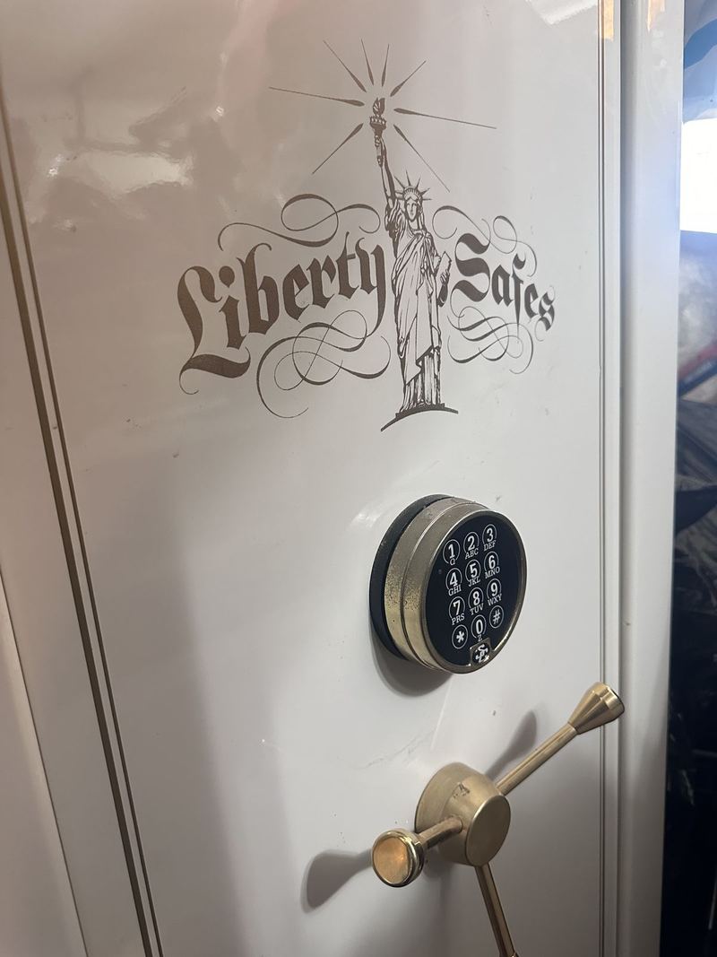 Liberty safe with electronic keypad and brass-colored handle