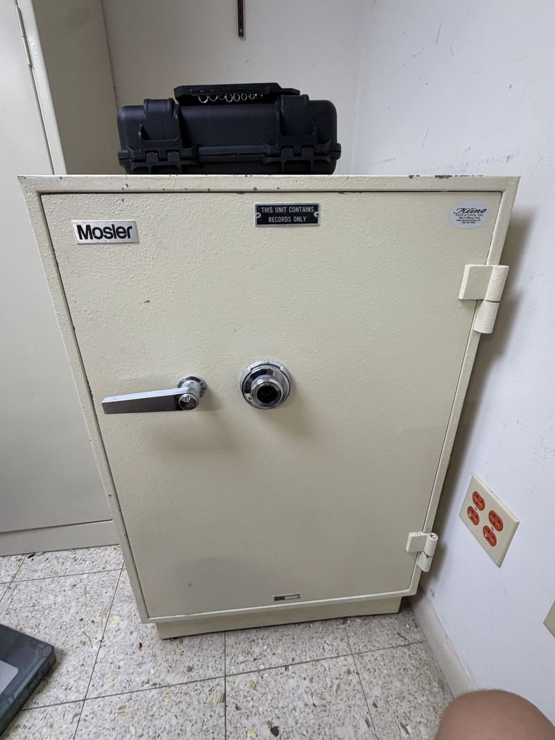 Beige Mosler safe with combination dial and handle